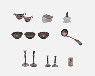 Lot 113 - Two pairs of silver plated candlesticks.