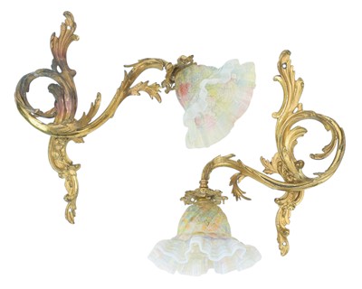 Lot 786 - A pair of ormolu wall lights with vaseline glass shades.