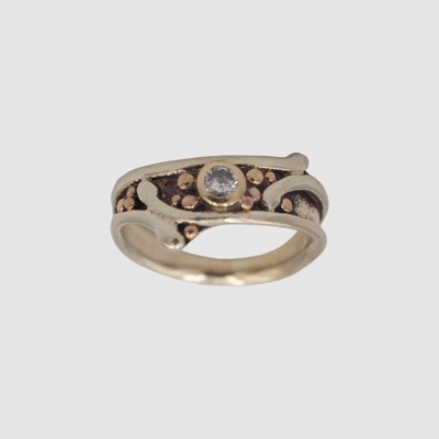 Lot 46 - LES GRIMSHAW - A 9k white and rose gold diamond set ring.