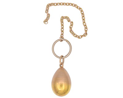 Lot 1 - An Imperial Russia gold egg locket pendant, on a gold split ring and gold chain.
