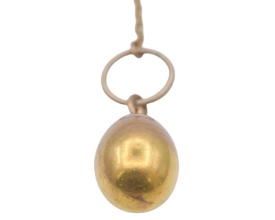 Lot 1 - An Imperial Russia gold egg locket pendant, on a gold split ring and gold chain.