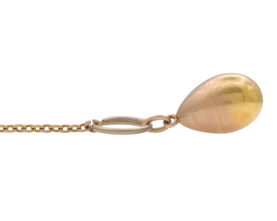 Lot 1 - An Imperial Russia gold egg locket pendant, on a gold split ring and gold chain.