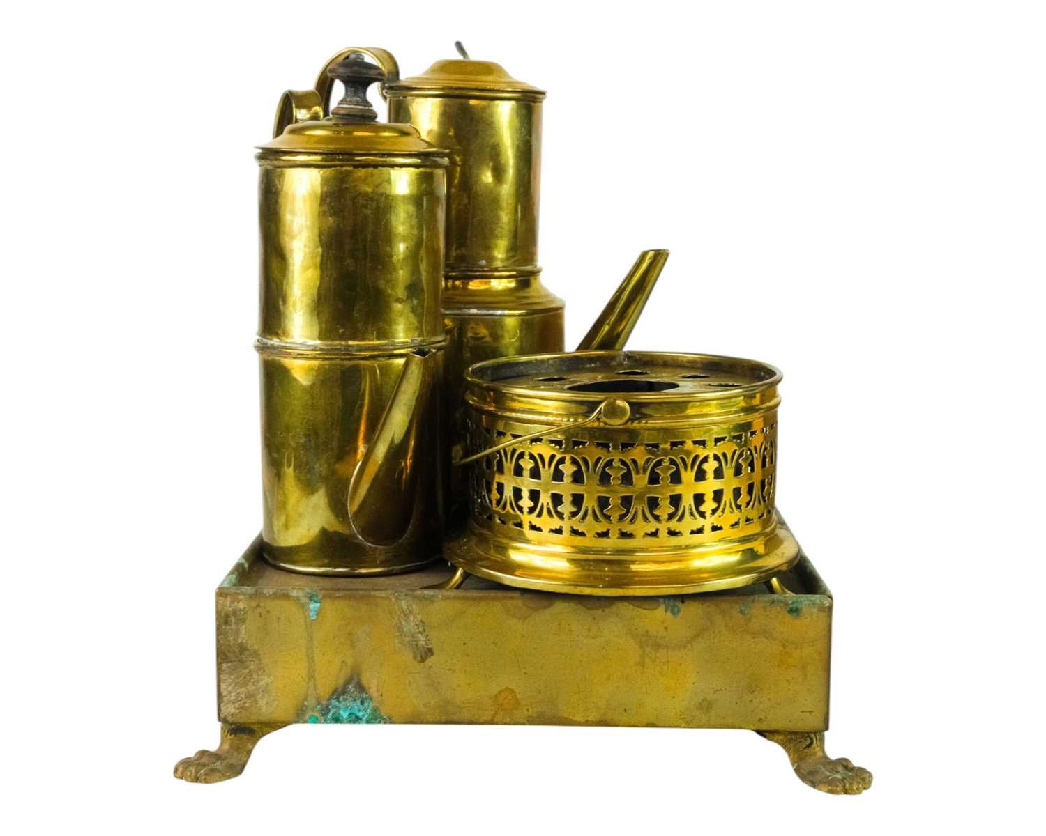 Lot 22 - A brass plate warmer, of pierced circular form, with swing handle.