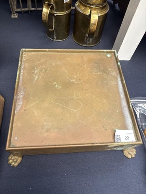 Lot 22 - A brass plate warmer, of pierced circular form, with swing handle.
