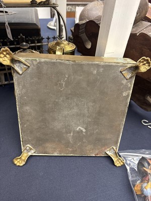 Lot 22 - A brass plate warmer, of pierced circular form, with swing handle.