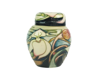 Lot 720 - A Moorcroft Orchid Arabesque pattern ginger jar and cover.