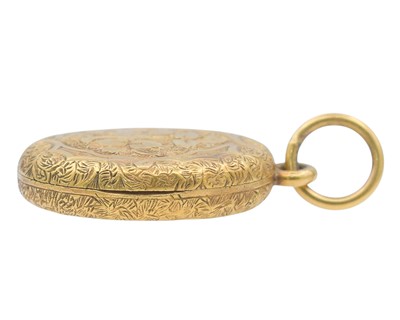 Lot 2 - A Victorian gold oval locket with foliate engraved decoration.
