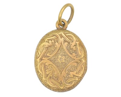 Lot 2 - A Victorian gold oval locket with foliate engraved decoration.