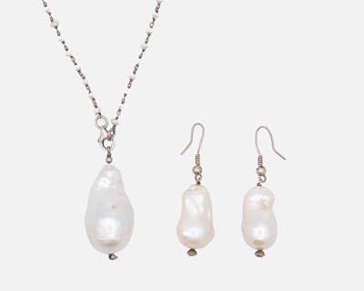 Lot 53 - A large cultured baroque pearl pendant, on a baroque pearl necklace, silver mounted.