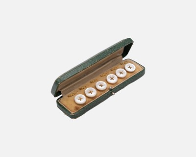 Lot 56 - A gilt-metal mother-of-pearl dress shirt button set, within original fitted box.