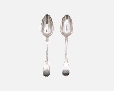 Lot 174 - Two George III silver fiddle-patterned table spoons.