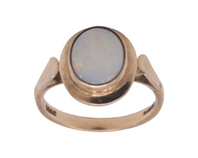 Lot 43 - A 9k hallmarked gold oval white opal set ring.