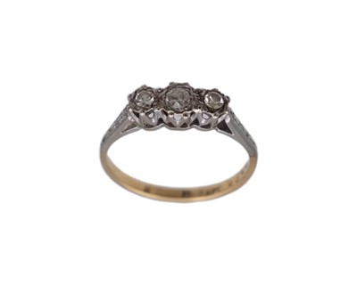 Lot 36 - An 18k and platinum diamond set three-stone ring.