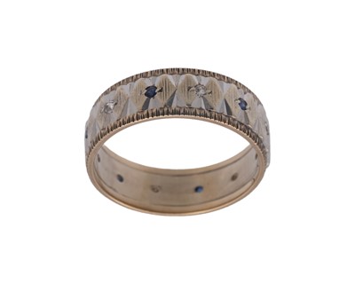 Lot 71 - A 9k white and yellow gold band ring, set with melee white spinels and blue sapphires.