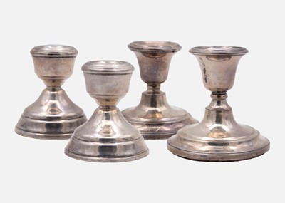 Lot 113A - A pair of silver stub candle sticks by Sloane & Carter.