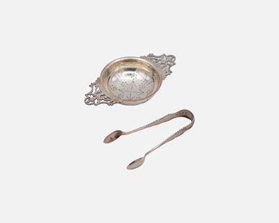 Lot 244 - An Elizabeth II silver tea strainer.