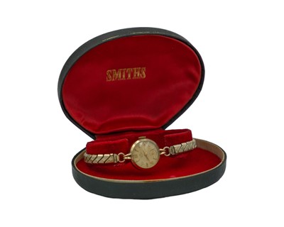 Lot 707 - SMITHS - A Deluxe 9k cased lady's manual wind wristwatch.