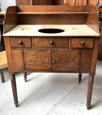 Lot 3238 - A George IV mahogany washstand in the manner...
