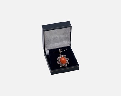 Lot 33 - A silver pendant set with an oval cabochon enhanced dyed orange opal, pink tourmalines and diamonds.