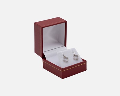 Lot 89 - A pair of silver openwork droplet earrings set with cubic zirconia.