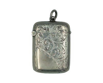Lot 588 - A silver fob vesta case with intricate bright cut design.