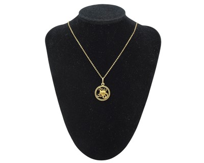 Lot 4 - An 18k Scorpio zodiac pendant on an 18k trace-link 20.75" neck chain.