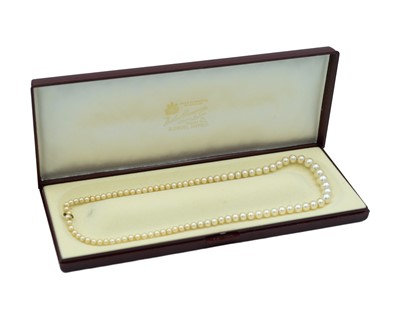 Lot 183 - A Ciro graduated string of faux pearls with 9k gold clasp.