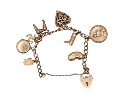 Lot 44 - A 9k charm bracelet with eight various 9k charms and padlock clasp.