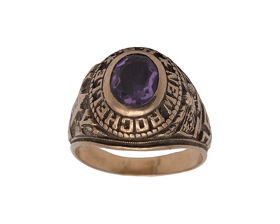 Lot 55 - A 10k and synthetic sapphire set American New Rochelle High School class ring.