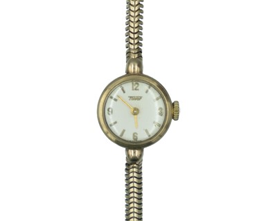 Lot 682 - TISSOT - A 9ct lady's manual wind bracelet wristwatch.