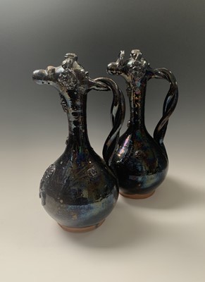 Lot 355 - A near pair of Canakkale black lustre glazed...