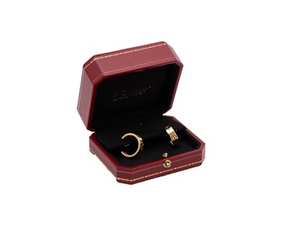 Lot 10 - CARTIER - A pair of 18k 'LOVE' hoop earrings, within original box.