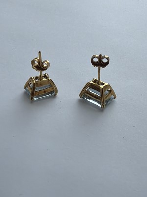 Lot 20 - A pair of good emerald-cut large aquamarine stud earrings, set in 18k gold.