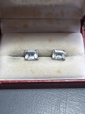 Lot 20 - A pair of good emerald-cut large aquamarine stud earrings, set in 18k gold.