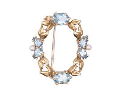 Lot 15 - CROP & FARR - A 9k hallmarked gold aquamarine and cultured seed pearl set annular brooch.