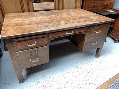 Lot 3152 - A 1920s oak pedestal desk, fitted an...