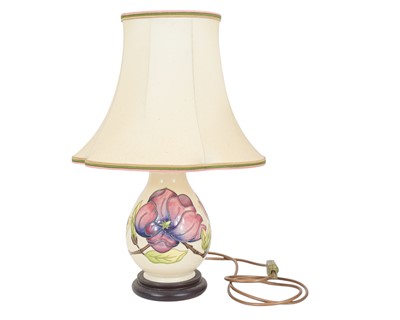 Lot 211 - A Moorcroft table lamp.