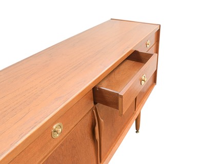 Lot 43 - A teak sideboard.