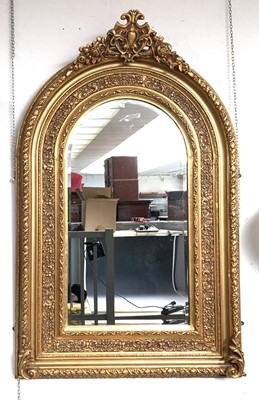 Lot 3216 - A mirror in ornate Victorian style gold...