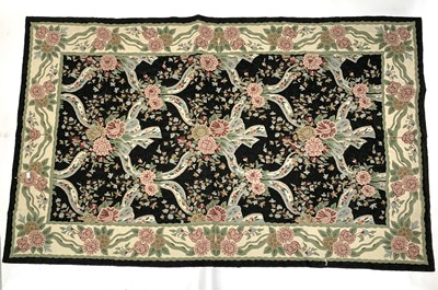 Lot 2847 - A black ground Aubusson style rug, 152 x 243cm.