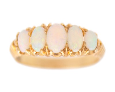 Lot 49 - An early 20th-century Australian white opal five-stone ring, set in 15k gold.