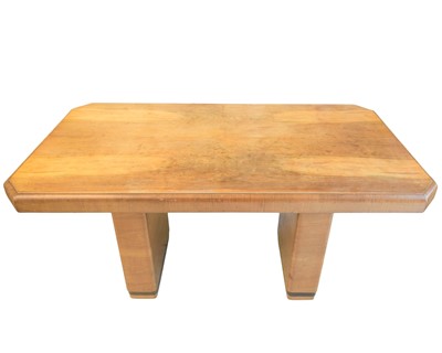 Lot 79 - An Art Deco walnut dining table.