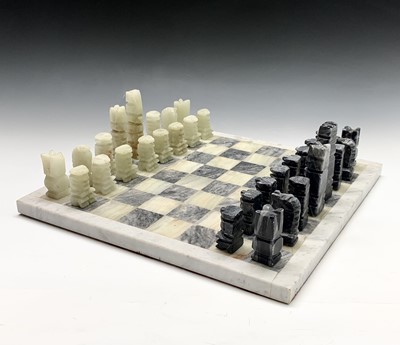 Lot 215 - An onyx and marble chess board, with pieces....