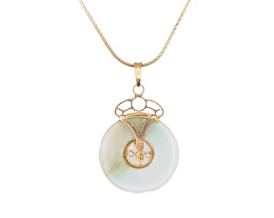 Lot 80 - A 14k mounted Jade disc pendant, on an 18k snake link neck chain.