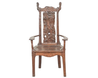 Lot 41 - A remarkable carved oak pegged elbow chair.