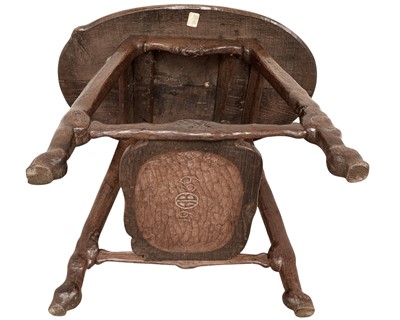 Lot 38 - An unusual carved oak two tier side table.