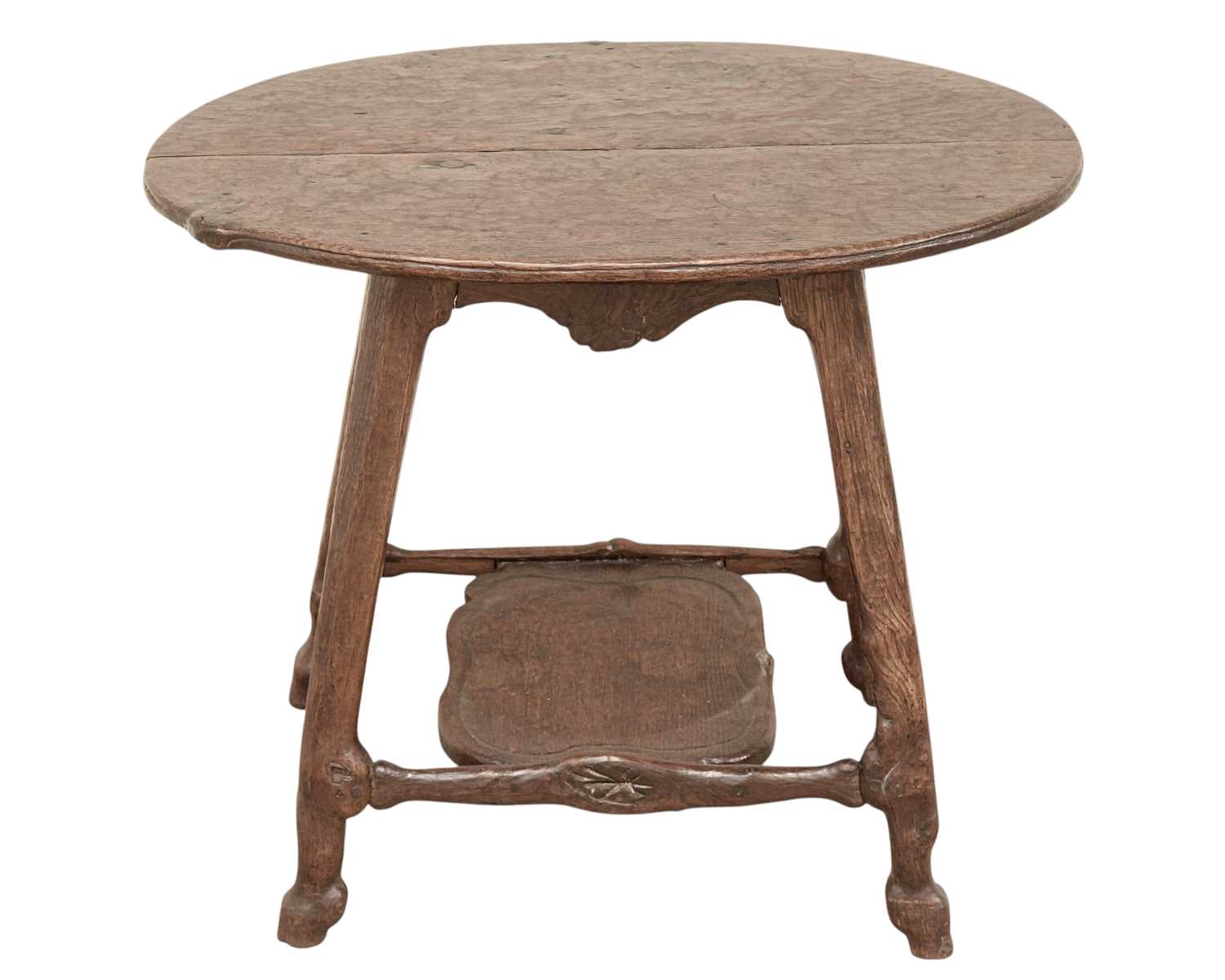 Lot 38 - An unusual carved oak two tier side table.