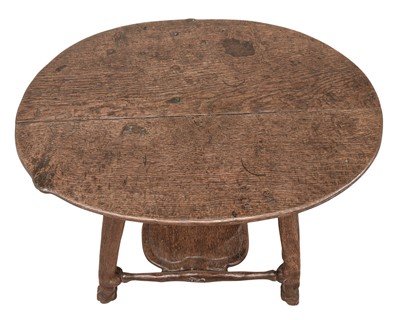 Lot 38 - An unusual carved oak two tier side table.
