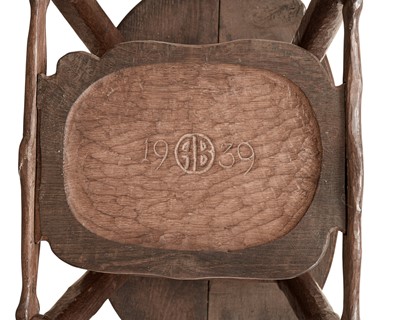Lot 38 - An unusual carved oak two tier side table.