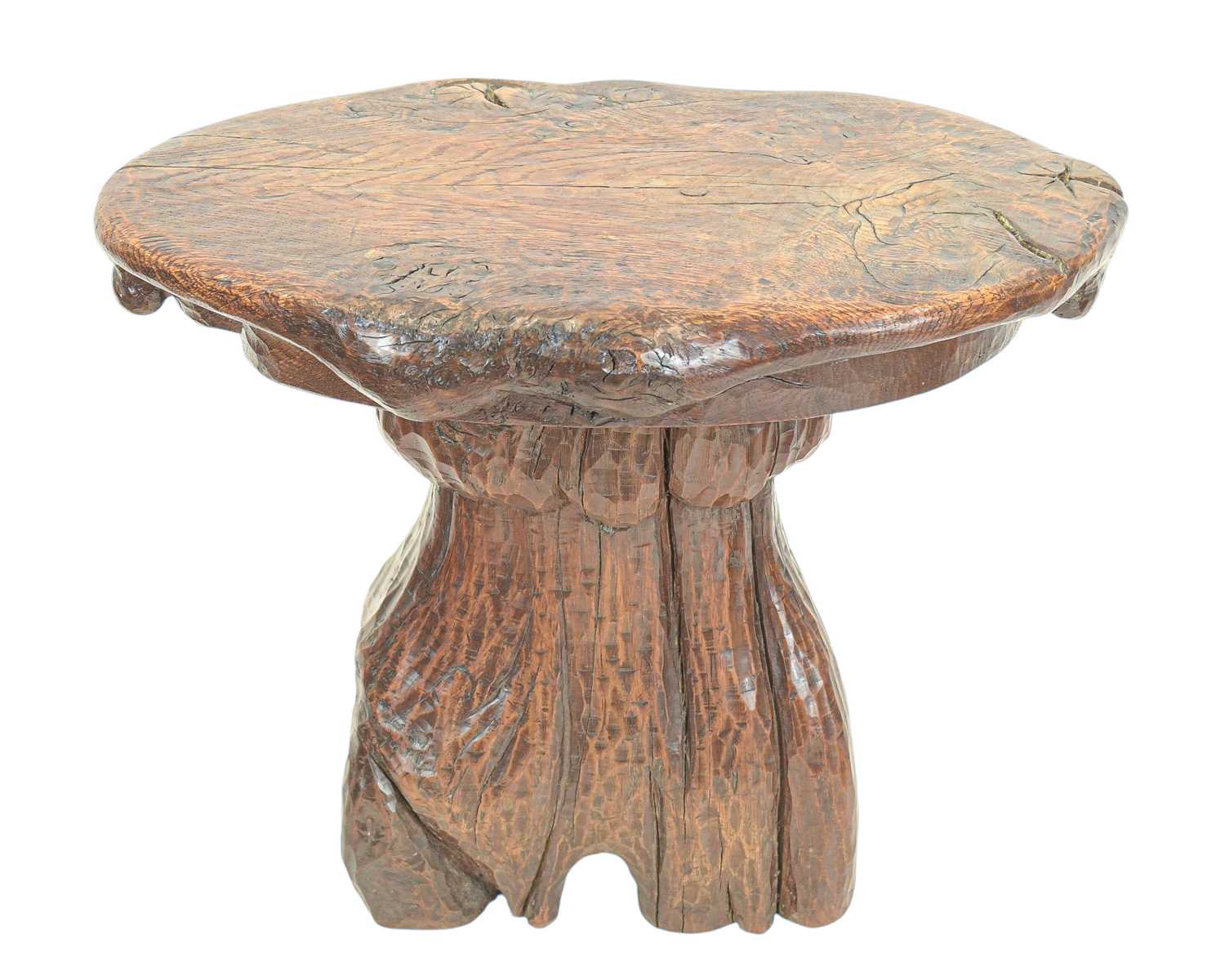 Lot 42 - A small carved oak stool.